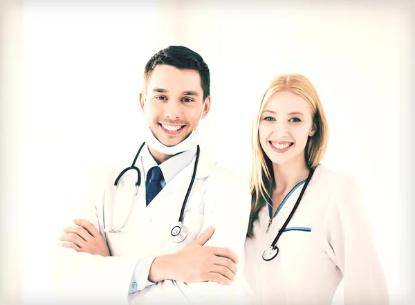 Two young attractive doctors — Stock Photo, Image