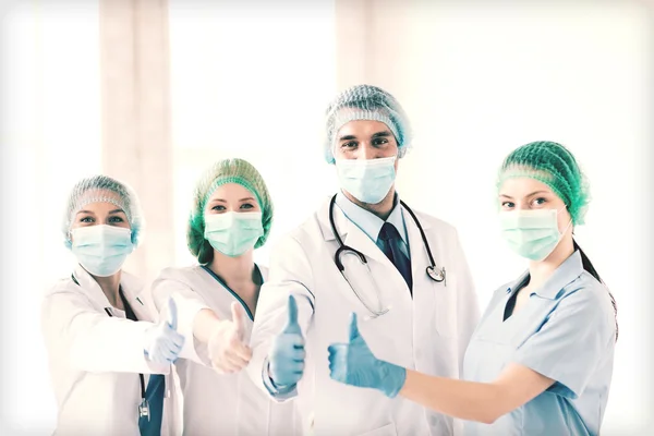Group of doctors in operating room — Stock Photo, Image