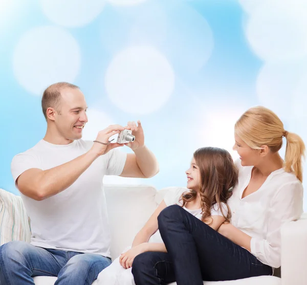 Happy family with camera at home — Stock Photo, Image