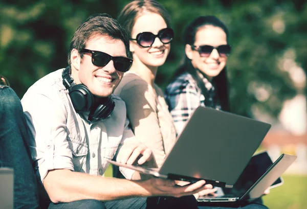 Students or teenagers with laptop computers — Stock Photo, Image