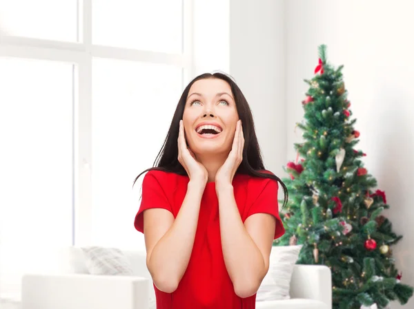 Smiling woman in red dress — Stock Photo, Image