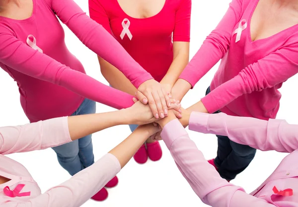 Close up of women with cancer awareness ribbons — Stock Photo, Image