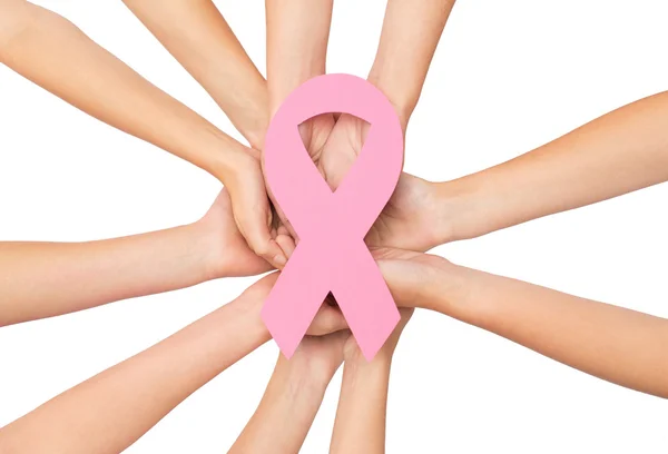 Close up of hands with cancer awareness symbol — Stock Photo, Image