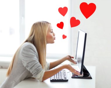 woman sending kisses with computer monitor clipart