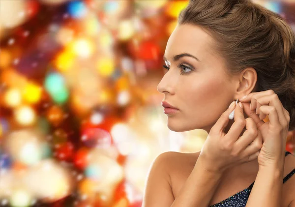 Close up of woman wearing earrings — Stock Photo, Image