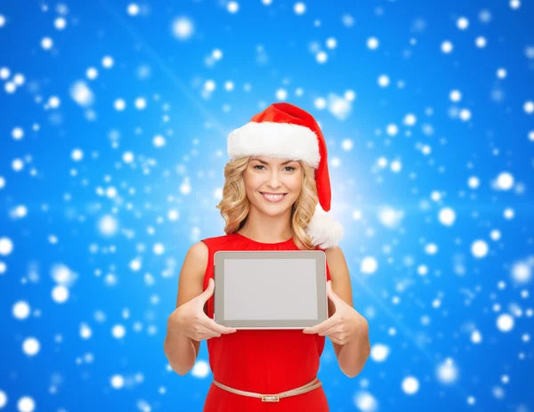 Mujer en sombrero de ayudante de santa con la tableta pc — Foto de Stock