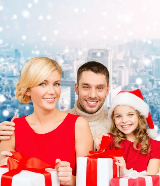 Happy family with gift boxes — Stock Photo, Image