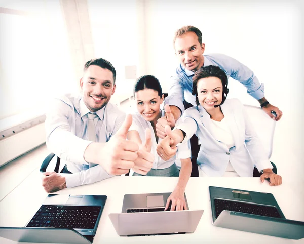 Group of office workers showing thumbs up — Stock Photo, Image