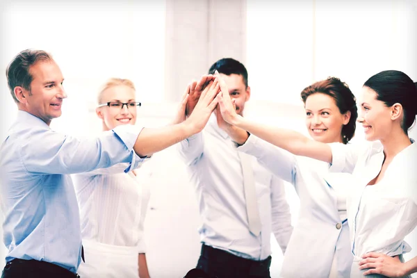 Business team celebrating victory in office — Stock Photo, Image