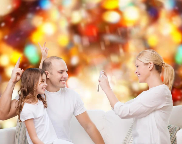 Happy family with camera at home — Stock Photo, Image