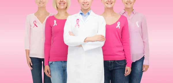 Close up of women with cancer awareness ribbons — Stock Photo, Image