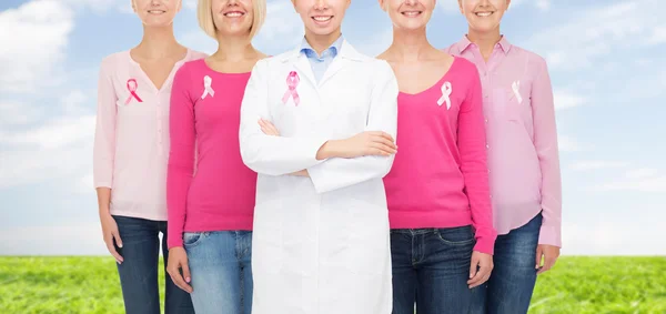 Close up of women with cancer awareness ribbons — Stock Photo, Image