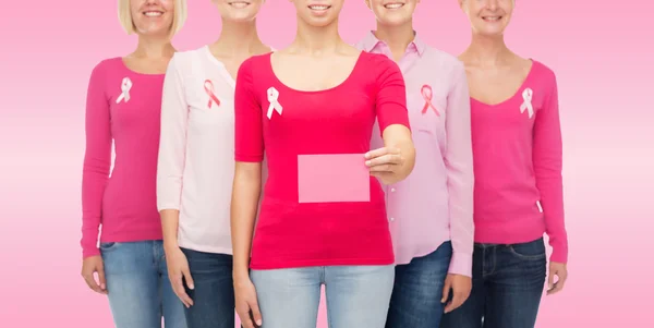 Close up of women with cancer awareness ribbons — Stock Photo, Image