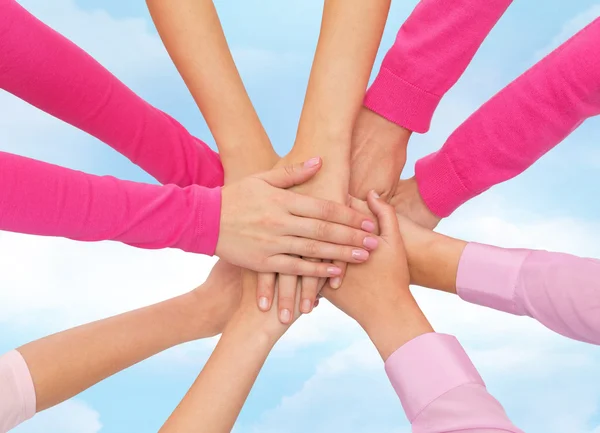 Close up of women with hands on top — Stock Photo, Image