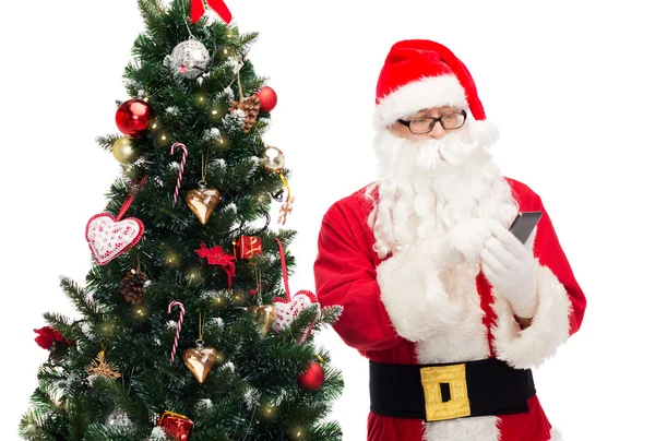 Noel Baba ile smartphone ve Noel ağacı — Stok fotoğraf