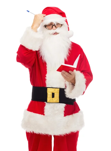 Mannen i kostym jultomten med anteckningar — Stockfoto