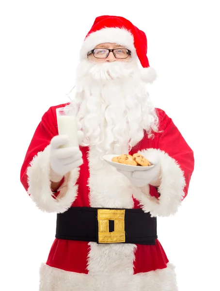 Santa claus with glass of milk and cookies — Stock Photo, Image