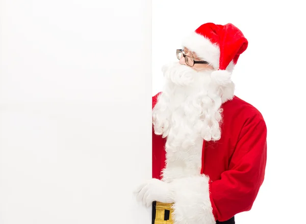 Man in costume of santa claus with billboard — Stock Photo, Image