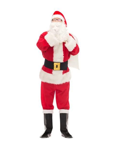 Homme en costume de Père Noël claus avec sac — Photo