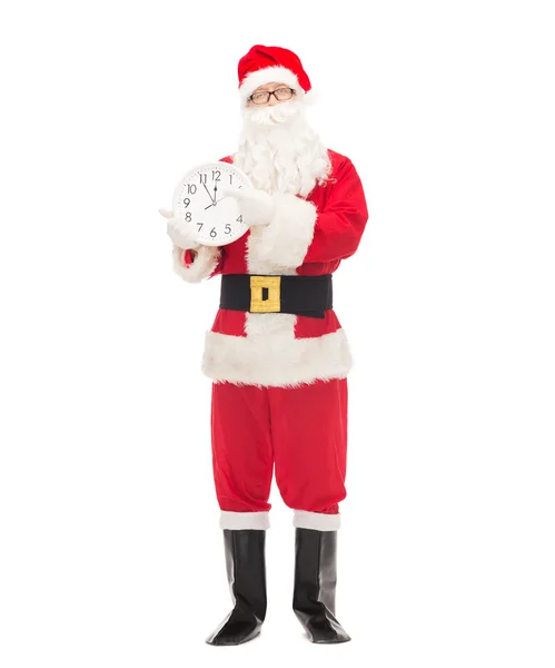 Man in costume of santa claus with clock — Stock Photo, Image