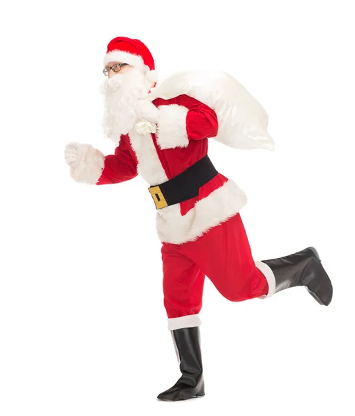 Man in costume of santa claus with bag — Stock Photo, Image