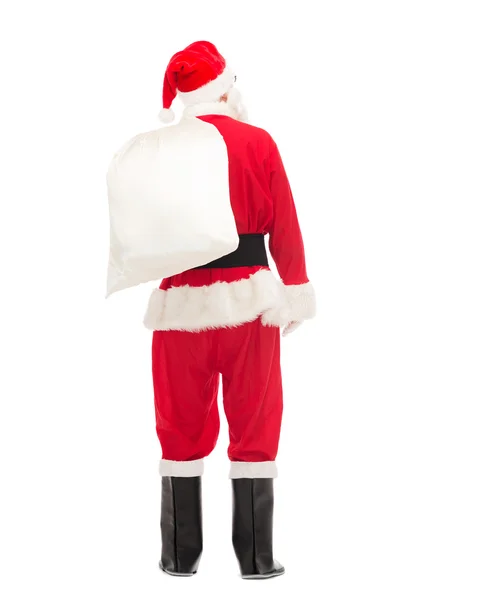 Mannen i kostym jultomten med väska — Stockfoto