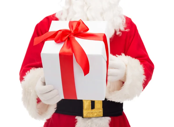 Man in costume of santa claus with gift box Stock Image