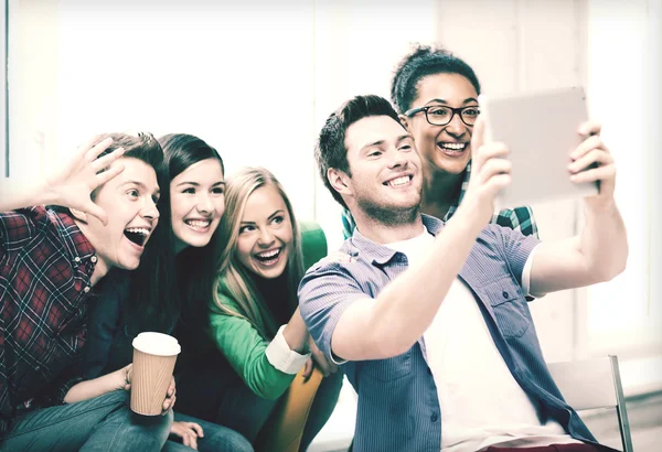 Students making picture with tablet pc at school — Stock Photo, Image