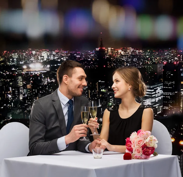 Couple with glasses of champagne at restaurant — Stock Photo, Image