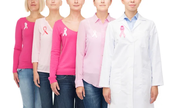 Close up of women with cancer awareness ribbons — Stock Photo, Image