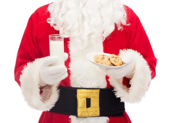 Close up of santa claus with milk and cookies — Stock Photo, Image