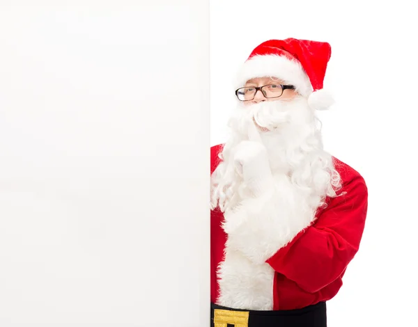 Man in costume of santa claus with billboard — Stock Photo, Image