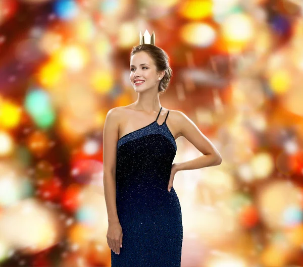 Smiling woman in evening dress wearing crown — Stock Photo, Image