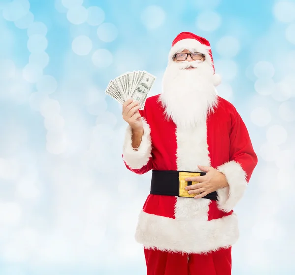 Man in costume of santa claus with dollar money — Stock Photo, Image