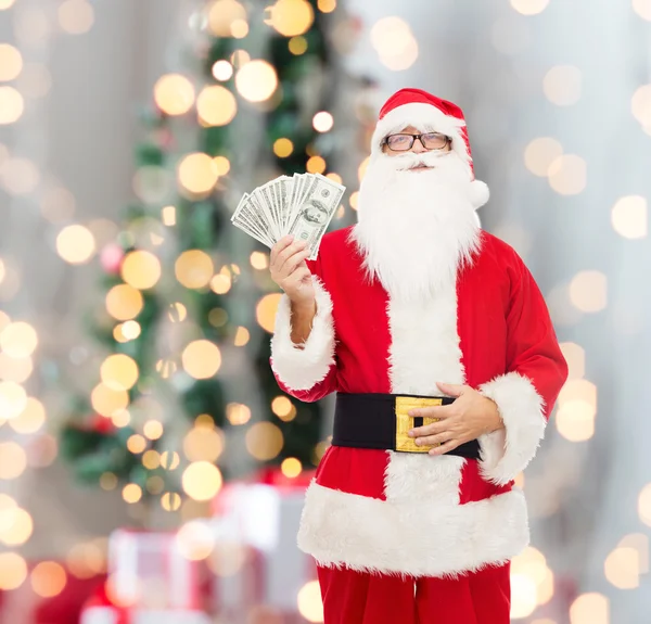 Man in costume of santa claus with dollar money — Stock Photo, Image