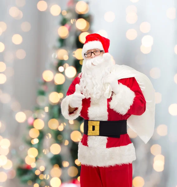 Man in costume of santa claus with bag — Stock Photo, Image