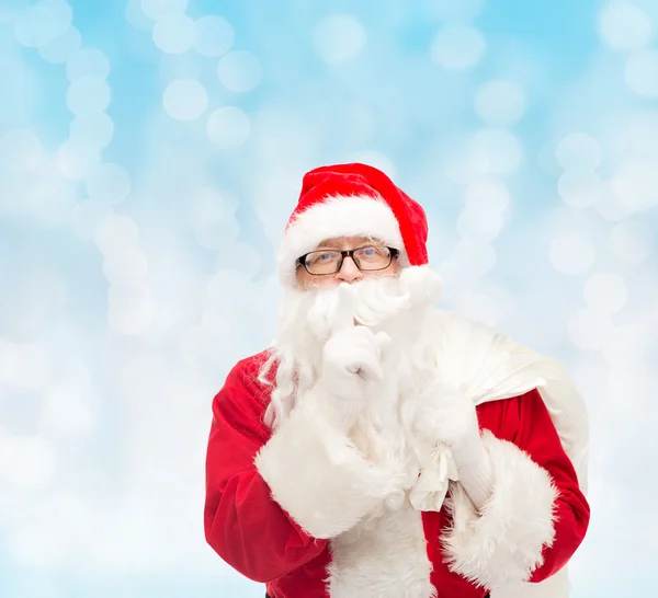 Homem em traje de santa claus com saco — Fotografia de Stock