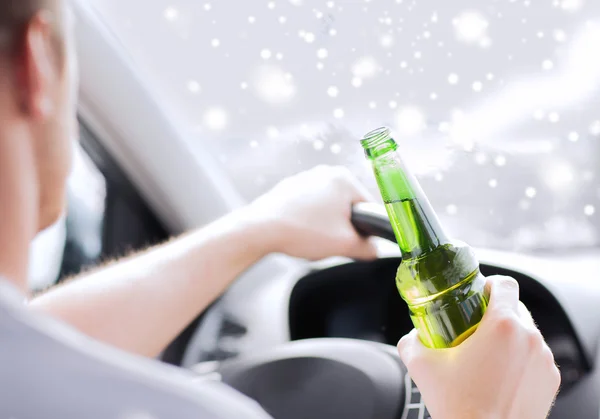 Close up of man drinking alcohol while driving car — Stock Photo, Image