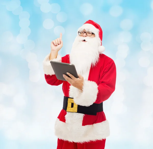 Man in costume of santa claus with tablet pc — Stock Photo, Image