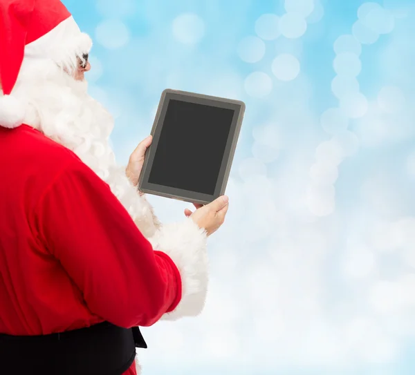 Man in costume of santa claus with tablet pc — Stock Photo, Image