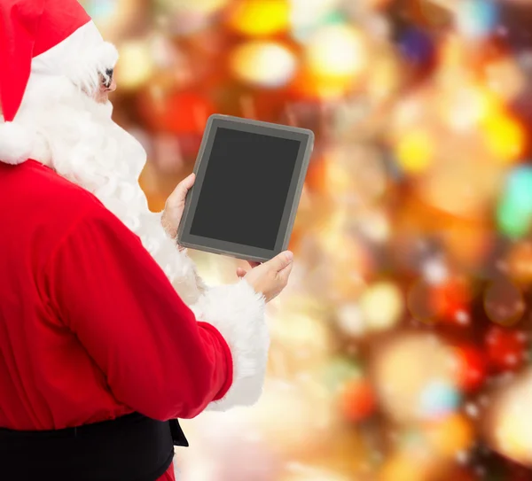 Man in costume of santa claus with tablet pc — Stock Photo, Image