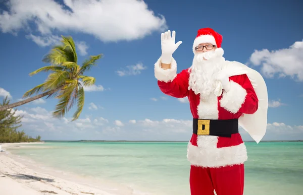 Homme en costume de Père Noël claus avec sac — Photo