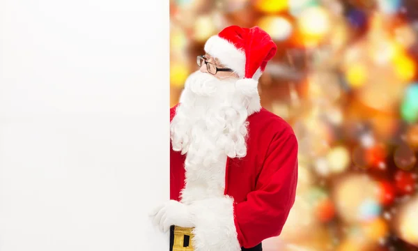 Man in costume of santa claus with billboard — Stock Photo, Image