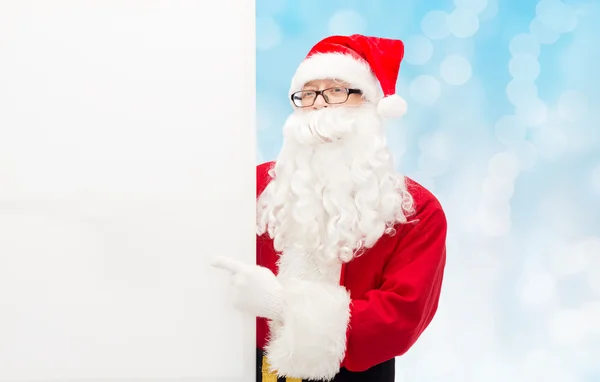 Man in costume of santa claus with billboard — Stock Photo, Image