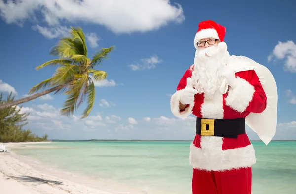 Man in costume of santa claus with bag — Stock Photo, Image