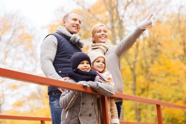 Happy family in autumn park — Stock Photo, Image