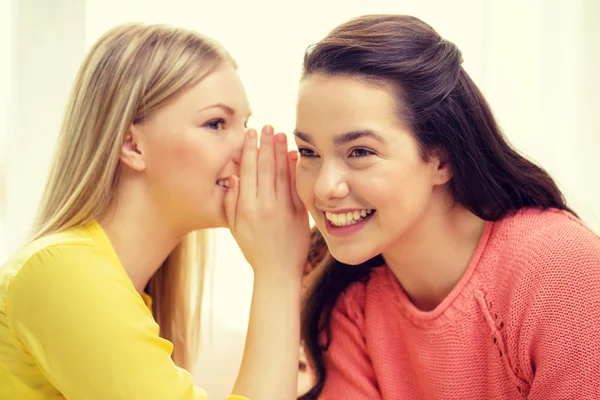 One girl telling another secret — Stock Photo, Image