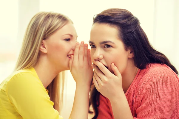 One girl telling another secret — Stock Photo, Image