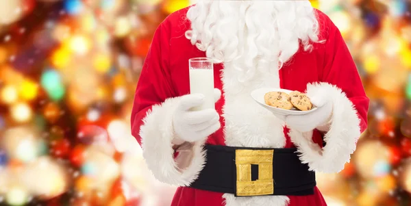 Santa claus with glass of milk and cookies — Stock Photo, Image