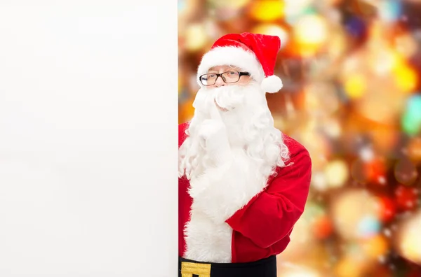 Man in costume of santa claus with billboard — Stock Photo, Image